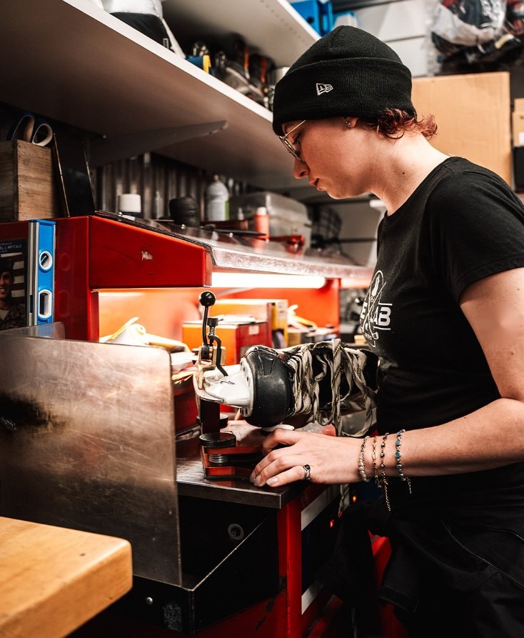 Hand sharpening skates at the Ice Lab bench