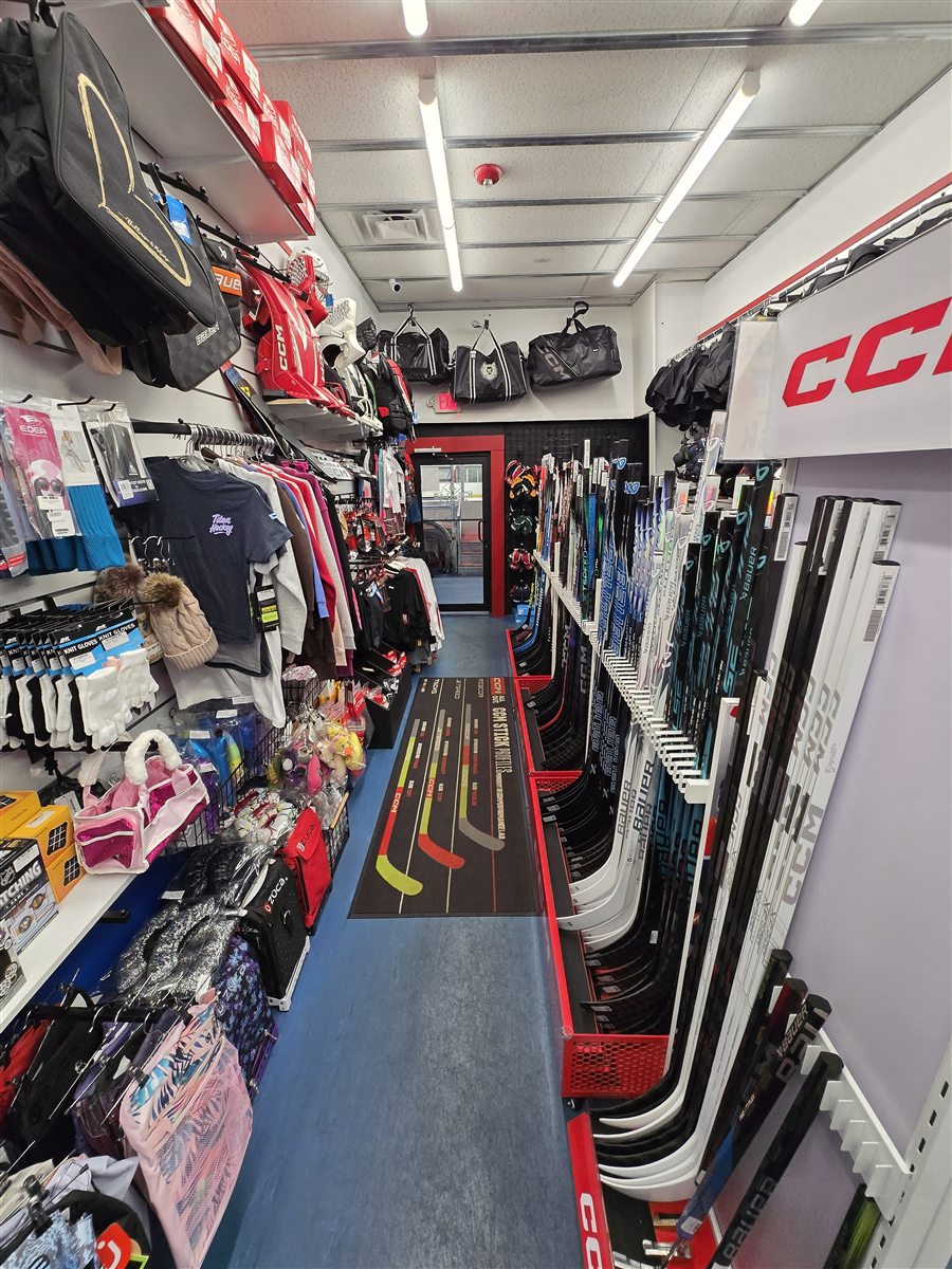 Wall of hockey gear at Ice Lab Pro Shop